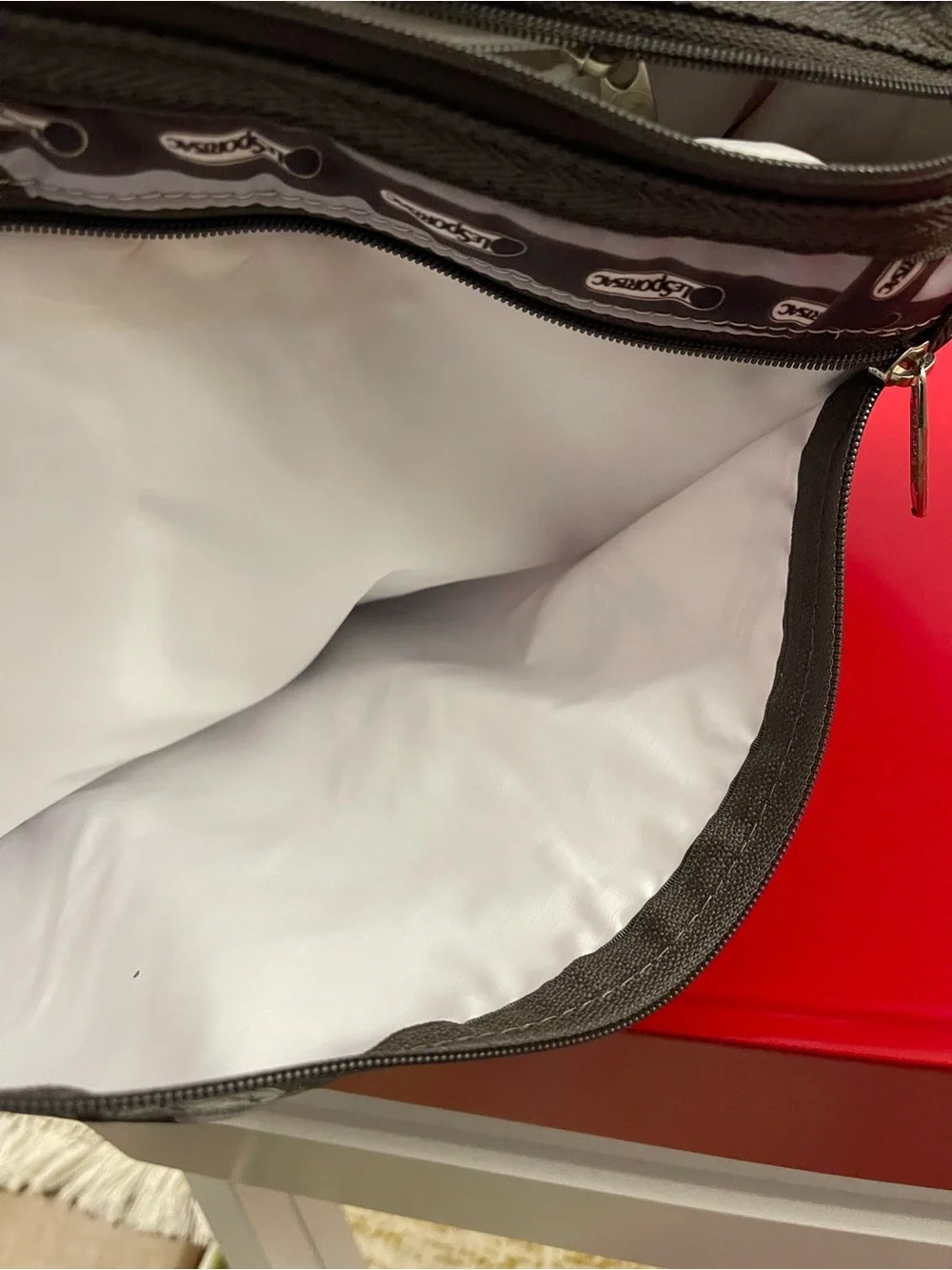 Lesportsac White and Brown Patterned Messenger Bag